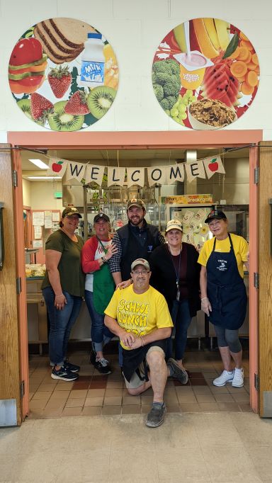 Kitchen staff posing for photo